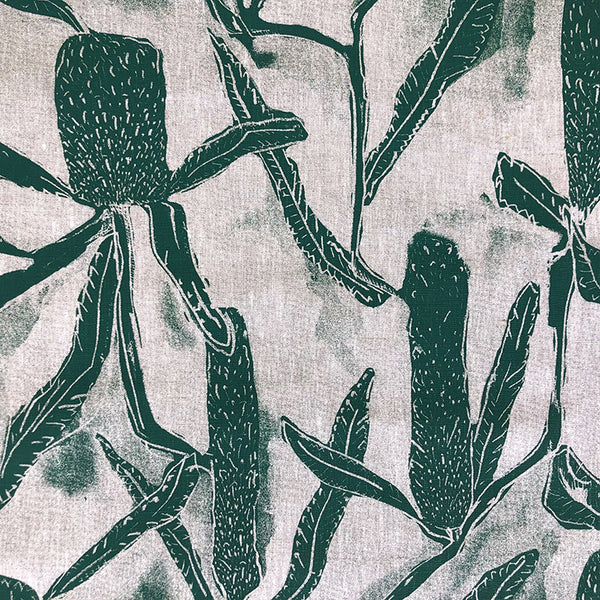 White tablecloth with mid green banksia print 