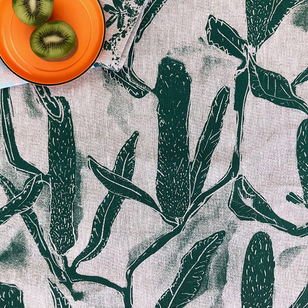 White and green tablecloth with australian native banksia pattern