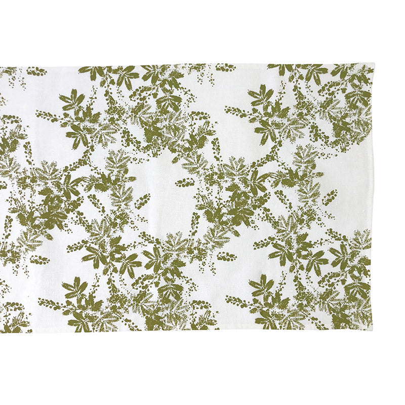 Linen table runner with green wattle print